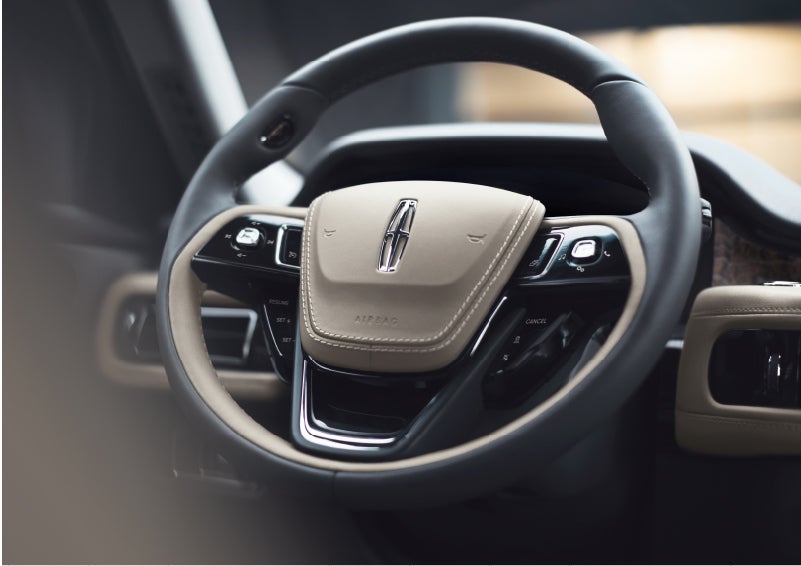The intuitively placed controls of the steering wheel on a 2023 Lincoln Aviator® SUV | Klaben Lincoln in Kent OH