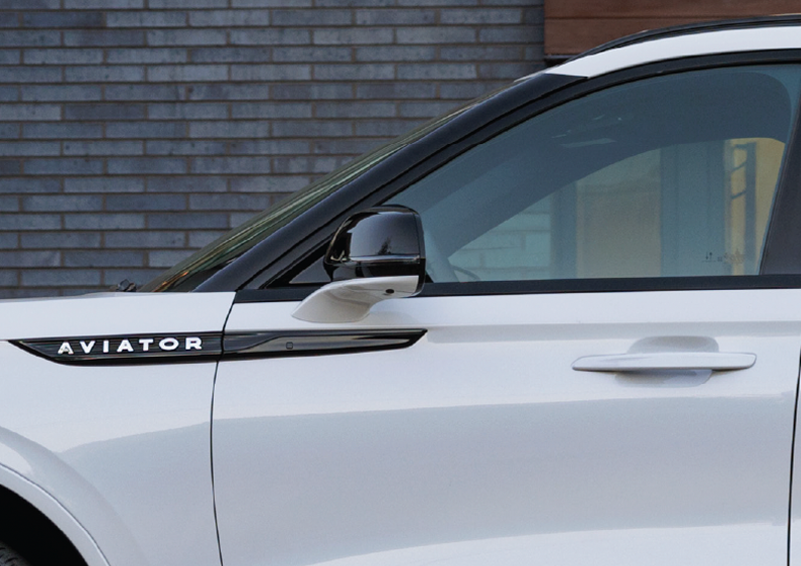 The driver’s door of a white 2025 Lincoln Aviator® SUV is showcased. | Klaben Lincoln in Kent OH