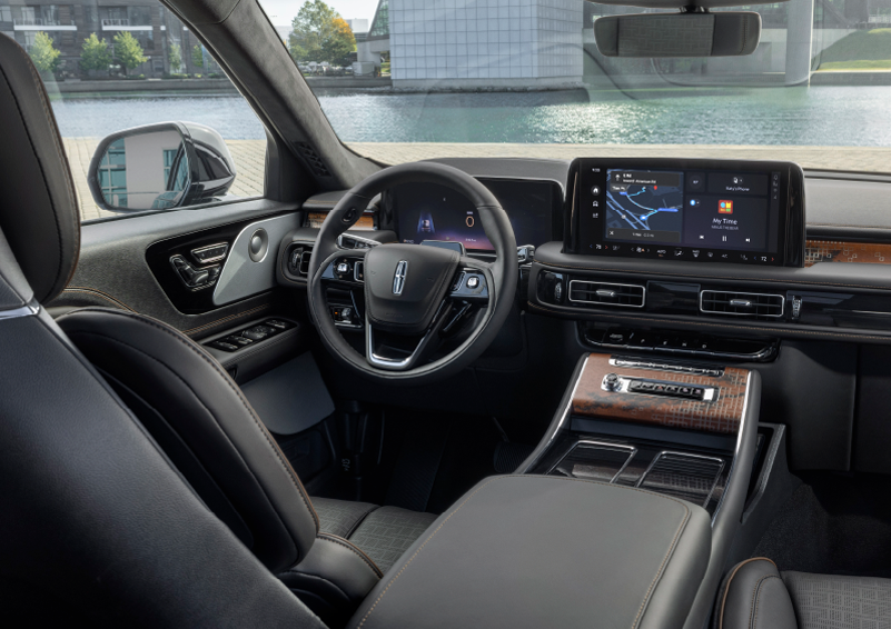 The interior of the 2025 Lincoln Aviator® SUV is shown parked with a view of a harbor through the windshield. | Klaben Lincoln in Kent OH
