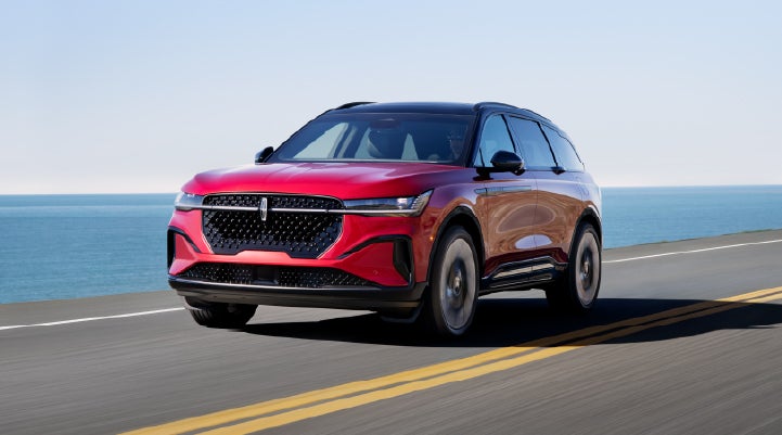 A 2025 Lincoln Nautilus® SUV is being driven on a seaside roadway. | Klaben Lincoln in Kent OH