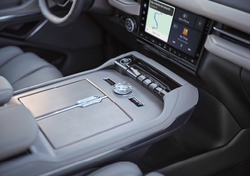 The head-up display projects driver information above the steering wheel at night.