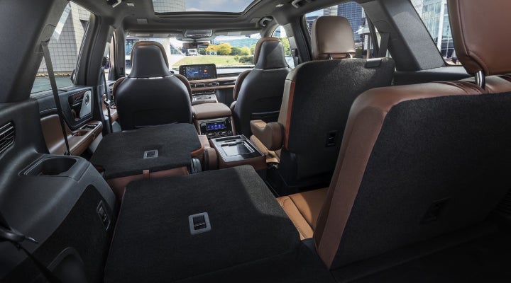 One side of the PowerFold® third-row seat and a second-row seat are folded forward in the 2026 Lincoln Aviator® SUV. | Klaben Lincoln in Kent OH