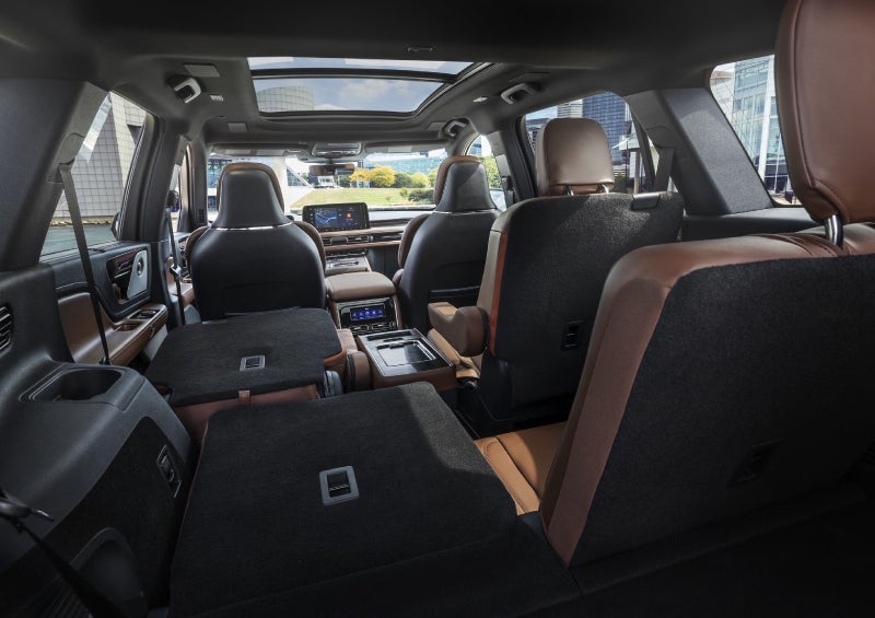 One side of the PowerFold® third-row seat and a second-row seat are folded forward in the 2026 Lincoln Aviator® SUV. | Klaben Lincoln in Kent OH