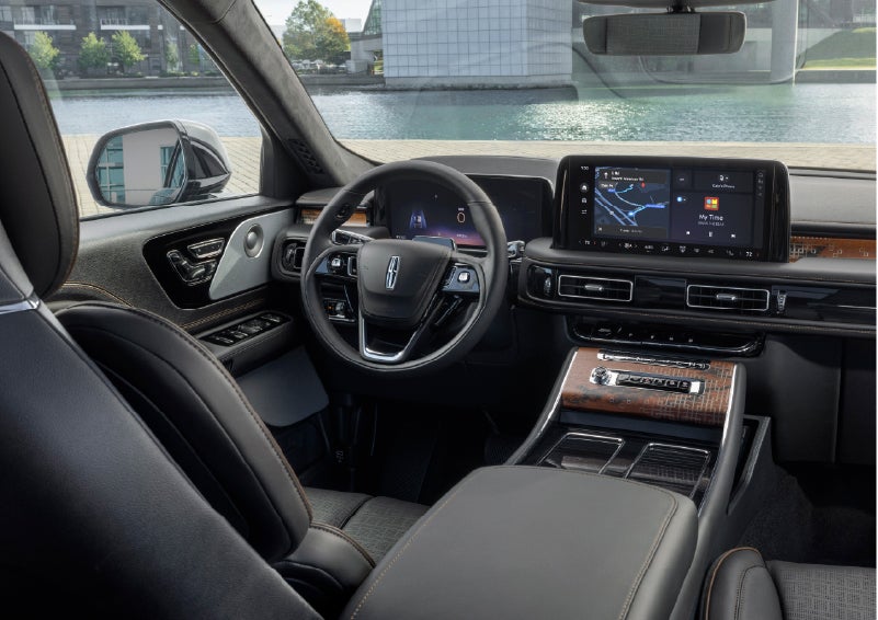 The interior of the 2026 Lincoln Aviator® SUV is shown parked with a view of a harbor through the windshield. | Klaben Lincoln in Kent OH