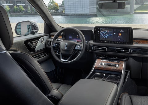The interior of the 2026 Lincoln Aviator® SUV is shown parked with a view of a harbor through the windshield. | Klaben Lincoln in Kent OH