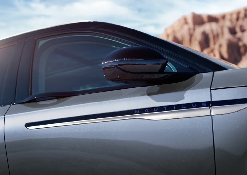 Blue lettering on the side of the vehicle that reads Nautilus indicates the available Hybrid Powertrain. | Klaben Lincoln in Kent OH