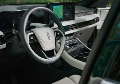 The leather-trimmed steering wheel of a 2027 Lincoln Aviator® Black Label™ SUV. | Klaben Lincoln in Kent OH